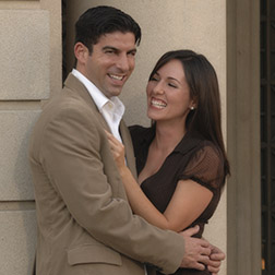 engaged couple is laughing uncontrollablly