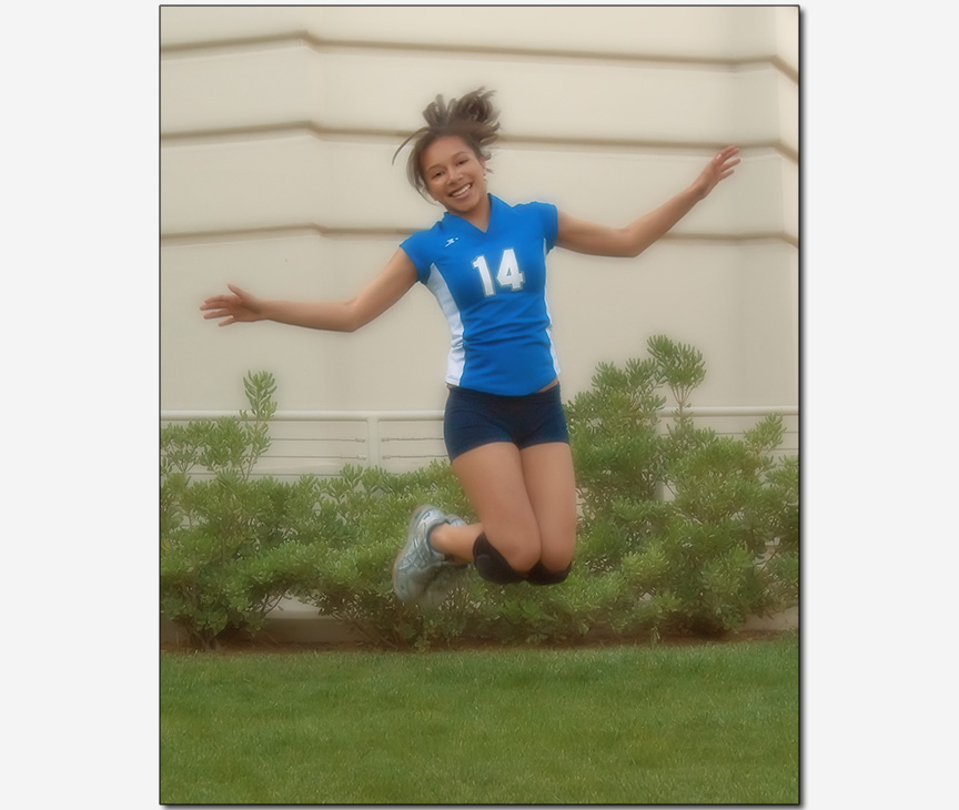 young girl jumps high in her pre-quinceanera photo session