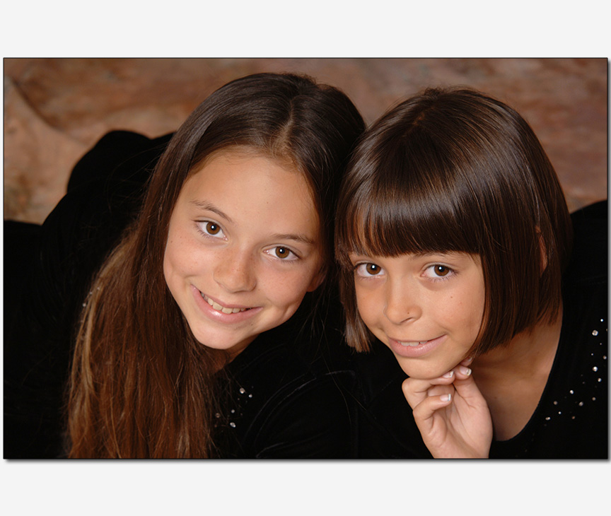 two young sisters in a cute pose